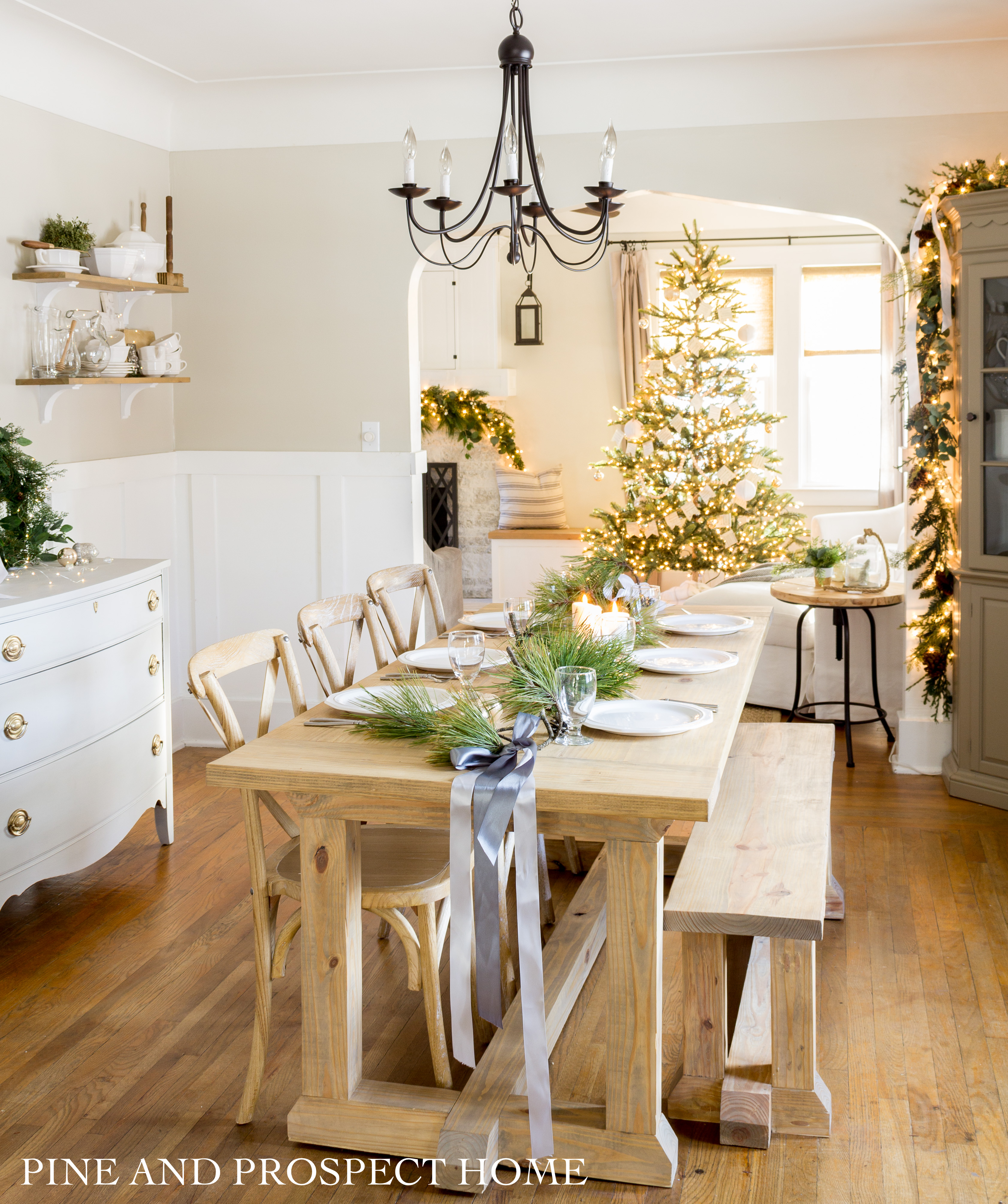 This might be the easiest Christmas tablescape you'll ever see! Simple branches and ribbon is all you need for this lovely tablescape.