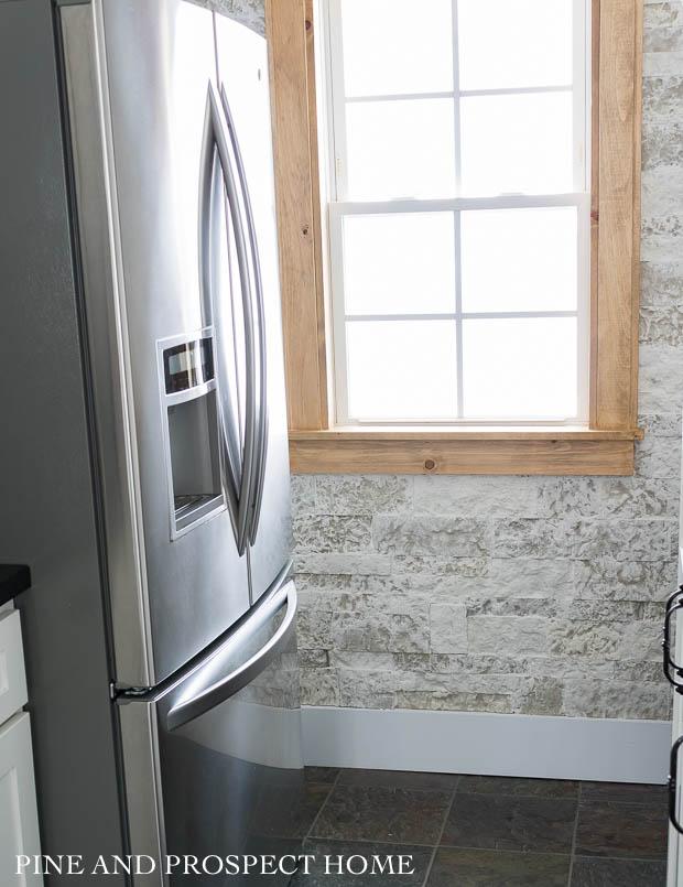 A stone accent wall can add rustic warmth to your space!
