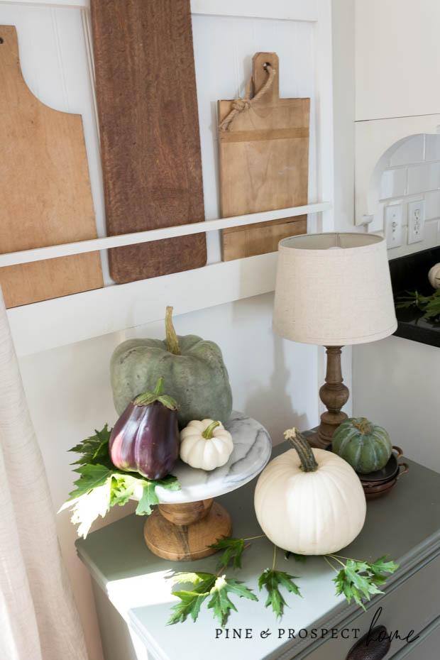 Fall kitchen decor using eggplant and pumpkins!