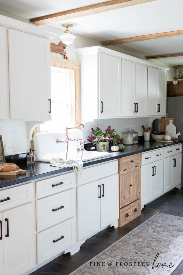 Fall kitchen decor with white pumpkins, eggplant and copper