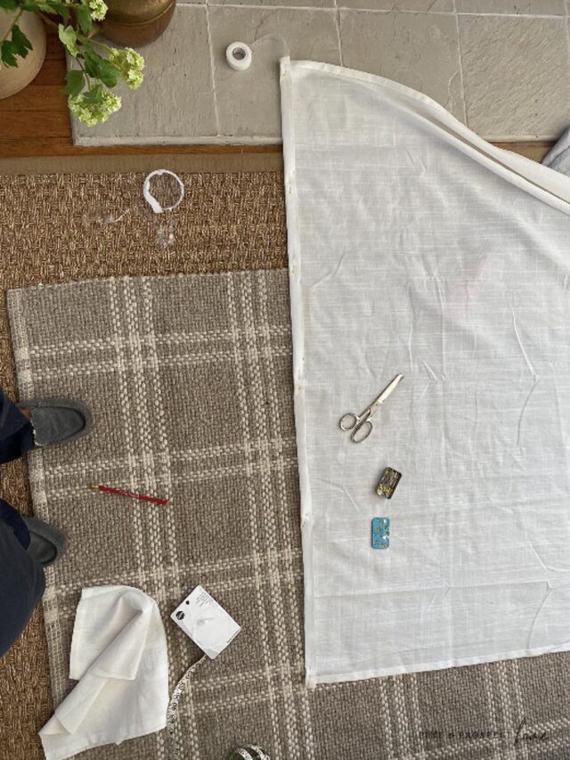 Easy no sew way to hem IKEA curtains, straight pin your edge