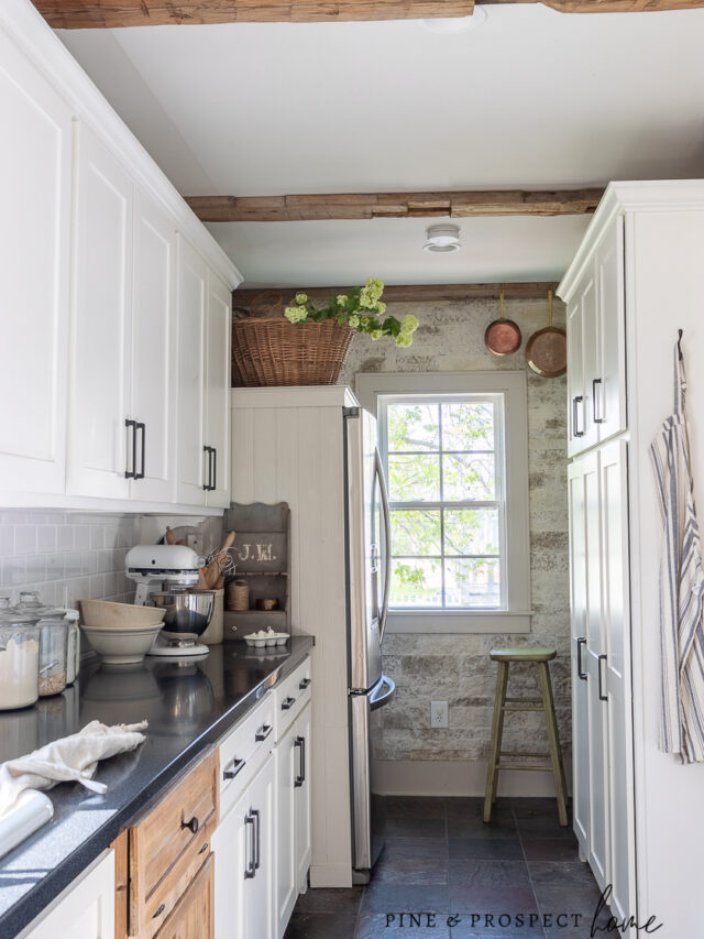 cropped-cottage-inspired-kitchen-with-reclaimed-beams-and-white-cabinets.jpg