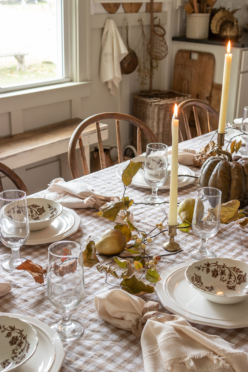 Use candles and candlelight to create a cozy Thanksgiving tablescape